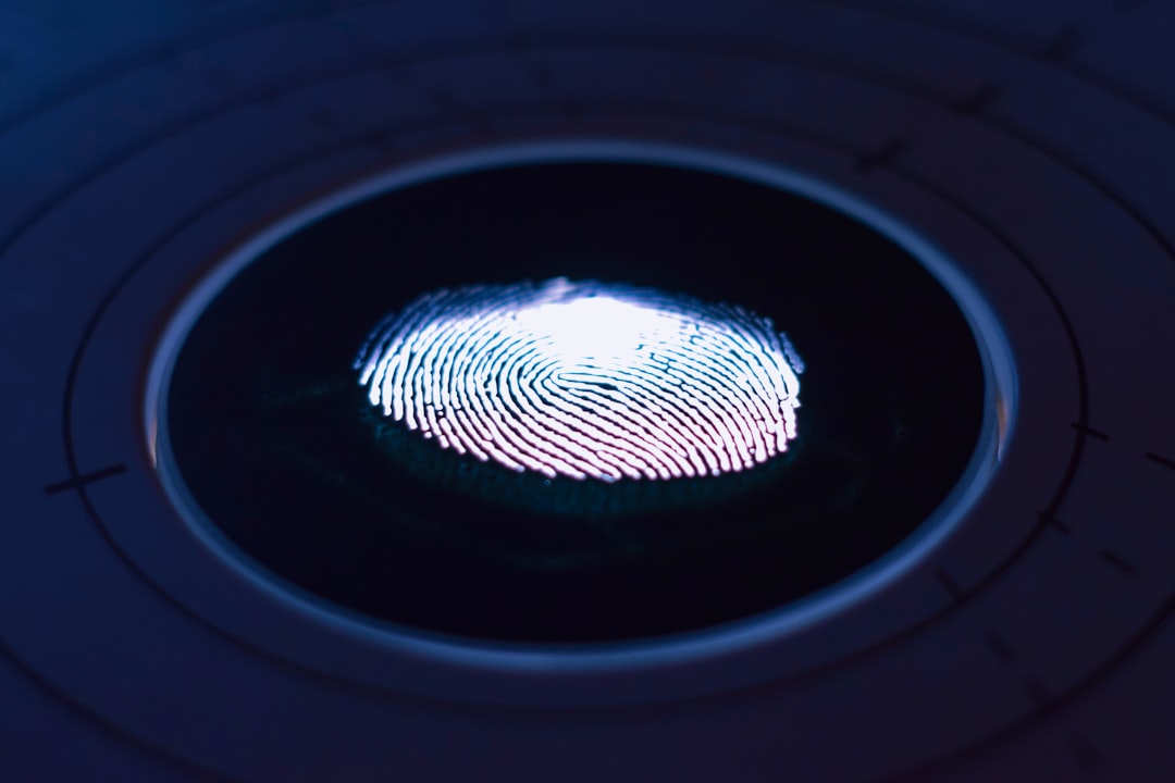 Fingerprint illuminated on a biometric scanner for Canada study permit processing