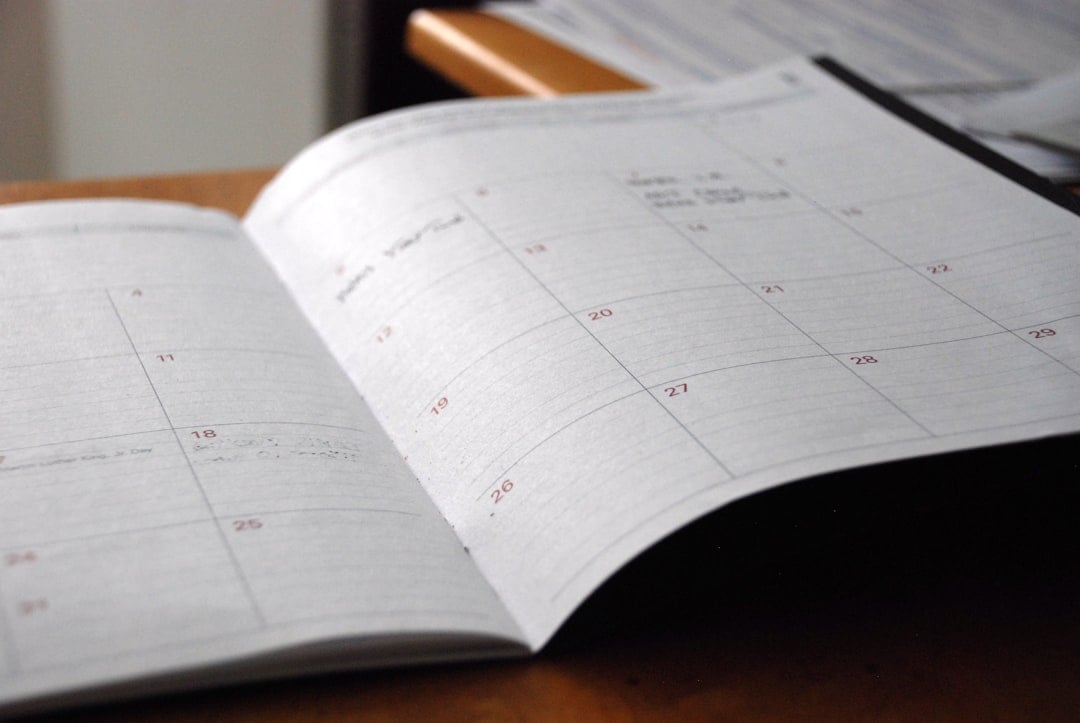 Open monthly planner showing calendar dates for tracking Canadian university application deadlines