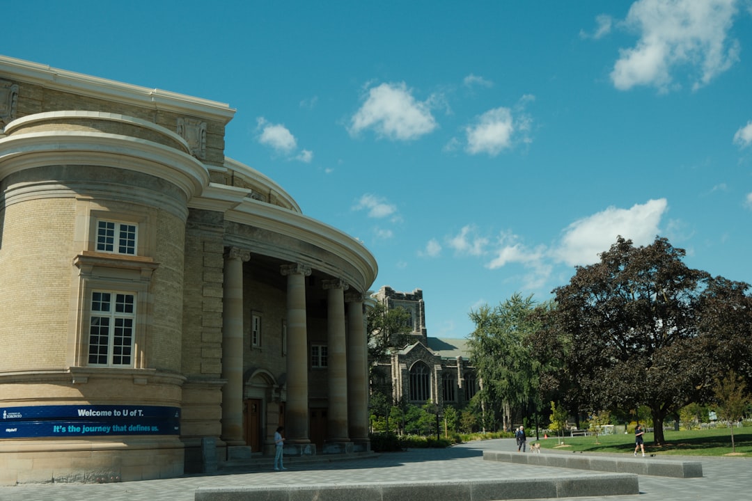 University of Toronto campus building with stone columns and Welcome to U of T banner
