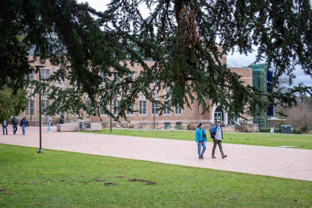 International students walking across a university campus on a crisp afternoon