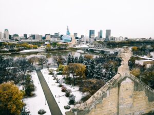 Winnipeg skyline with Canadian Museum for Human Rights and Esplanade Riel bridge in winter snow