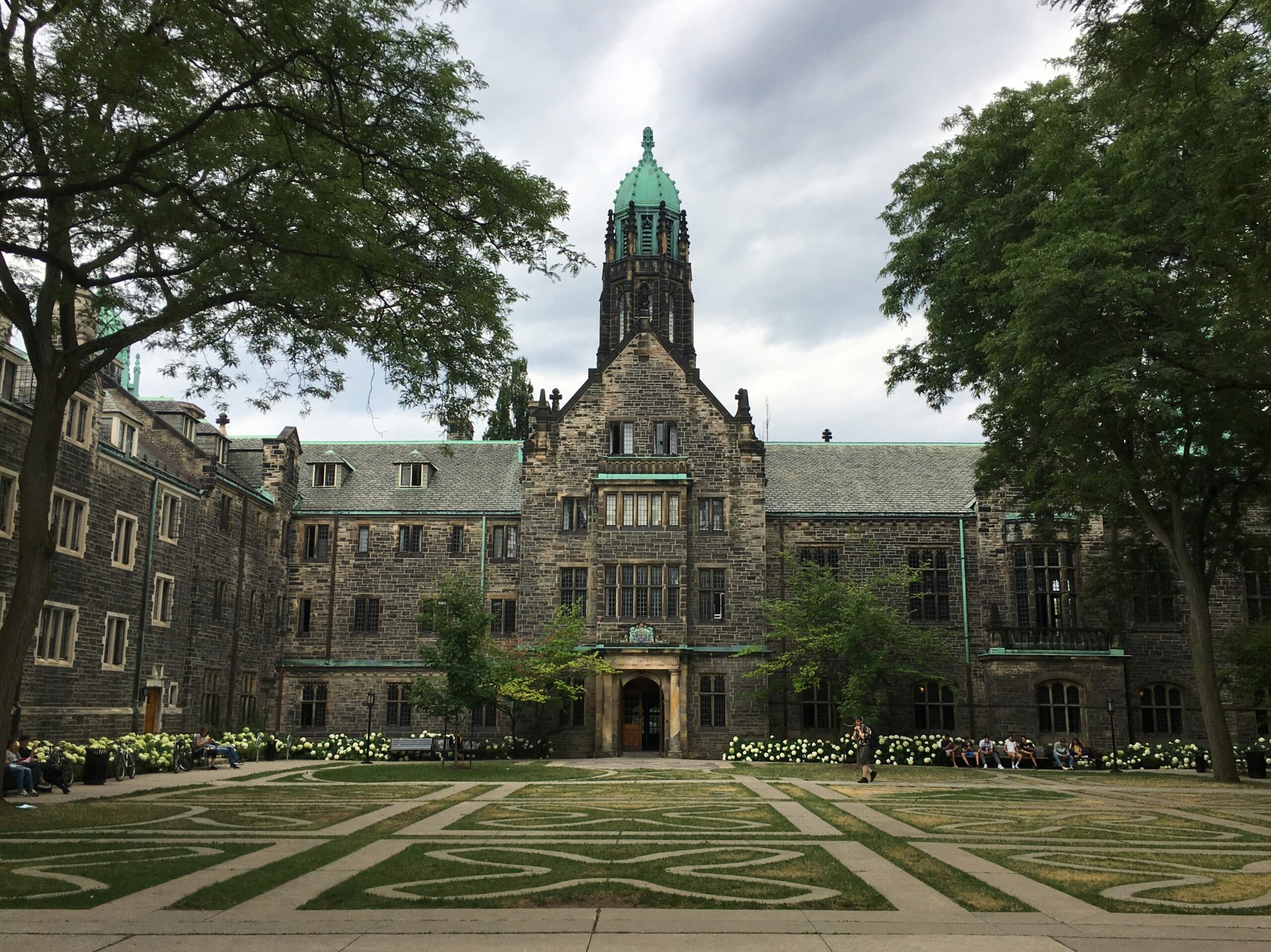 Trinity College at University of Toronto campus courtyard, iconic study in Canada destination for international students